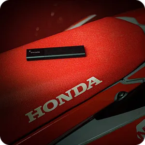 A Classic GPS Tracker placed on a red motorcycle